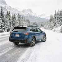 AWD vehicle on a snowy Calgary road with winter tires