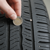 The Toonie Test: How to Check Tire Tread Depth at Home - Prince Tires