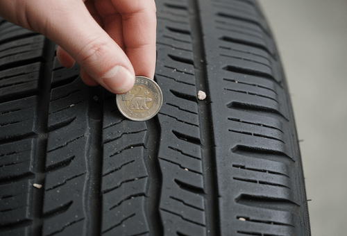 The Toonie Test: How to Check Tire Tread Depth at Home - Prince Tires