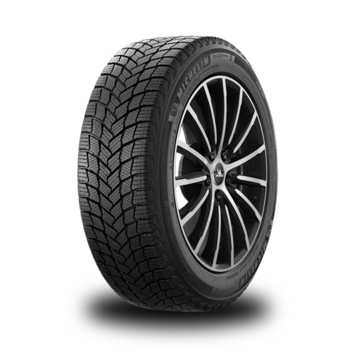 Car tire with winter tread pattern on a white background